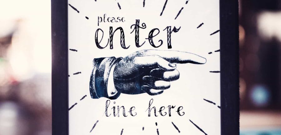 Enter Here sign with finger point inside