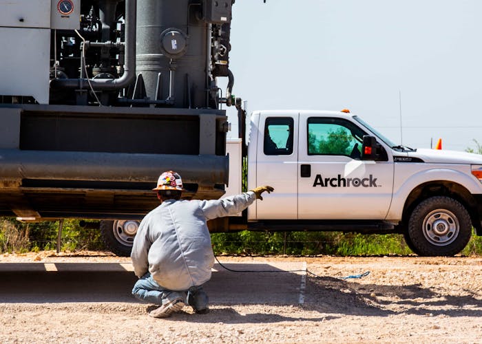 Man working by Archrock truck