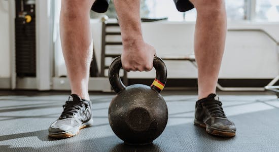Man with working hands clasped together