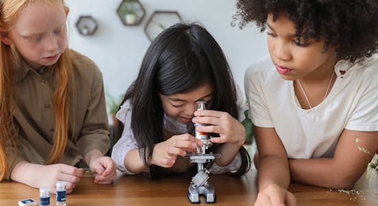 Kids using microscope