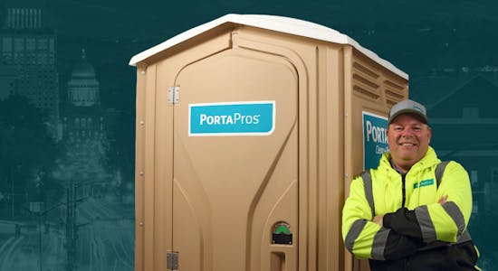 PortaPros employee leaning against toilet